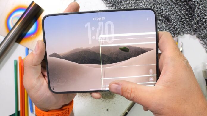Apple iPhone Duo foldable phone shown open with its large inner display visible.