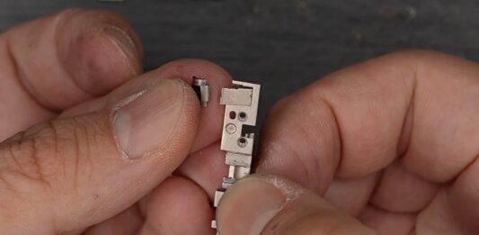 Broken iPhone Duo Hinge Part Offers a New Clue to Inner-Screen Cracks
