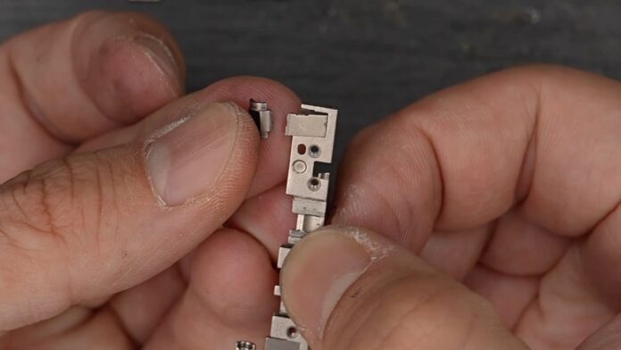 Broken iPhone Duo Hinge Part Offers a New Clue to Inner-Screen Cracks